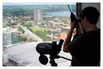 A Falconwatch coordinator keeps watch from the top floor of the Stelco Tower